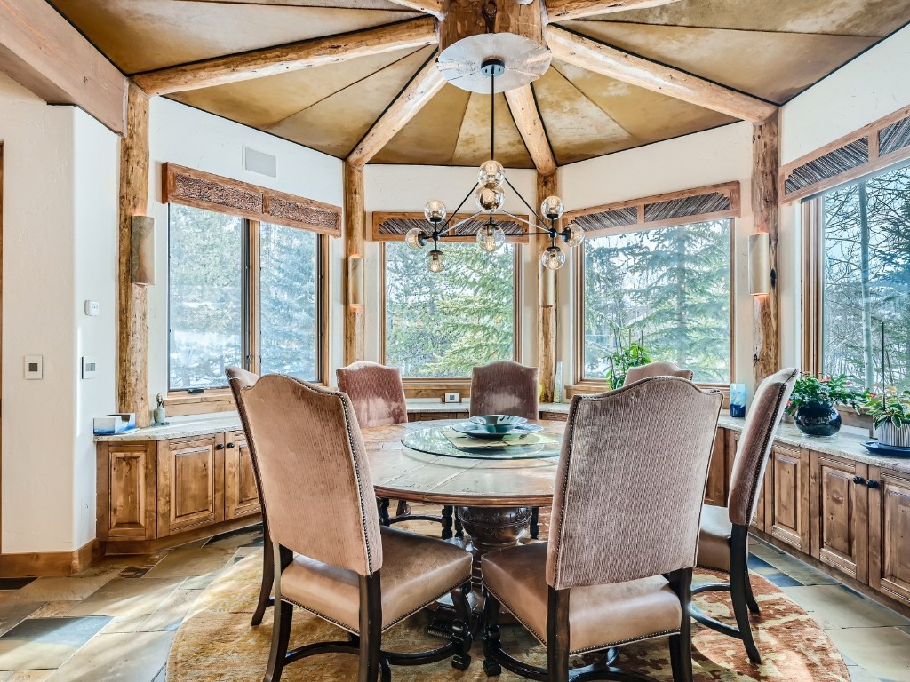 1817 Falcon Drive Silverthorne, CO 80498 - Photo 13 of 37 a view of a dining room with furniture window and outside view