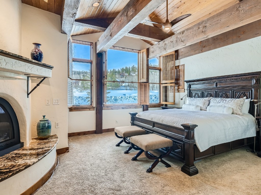 1817 Falcon Drive Silverthorne, CO 80498 - Photo 17 of 37 a spacious bedroom with a bed and a flat screen tv