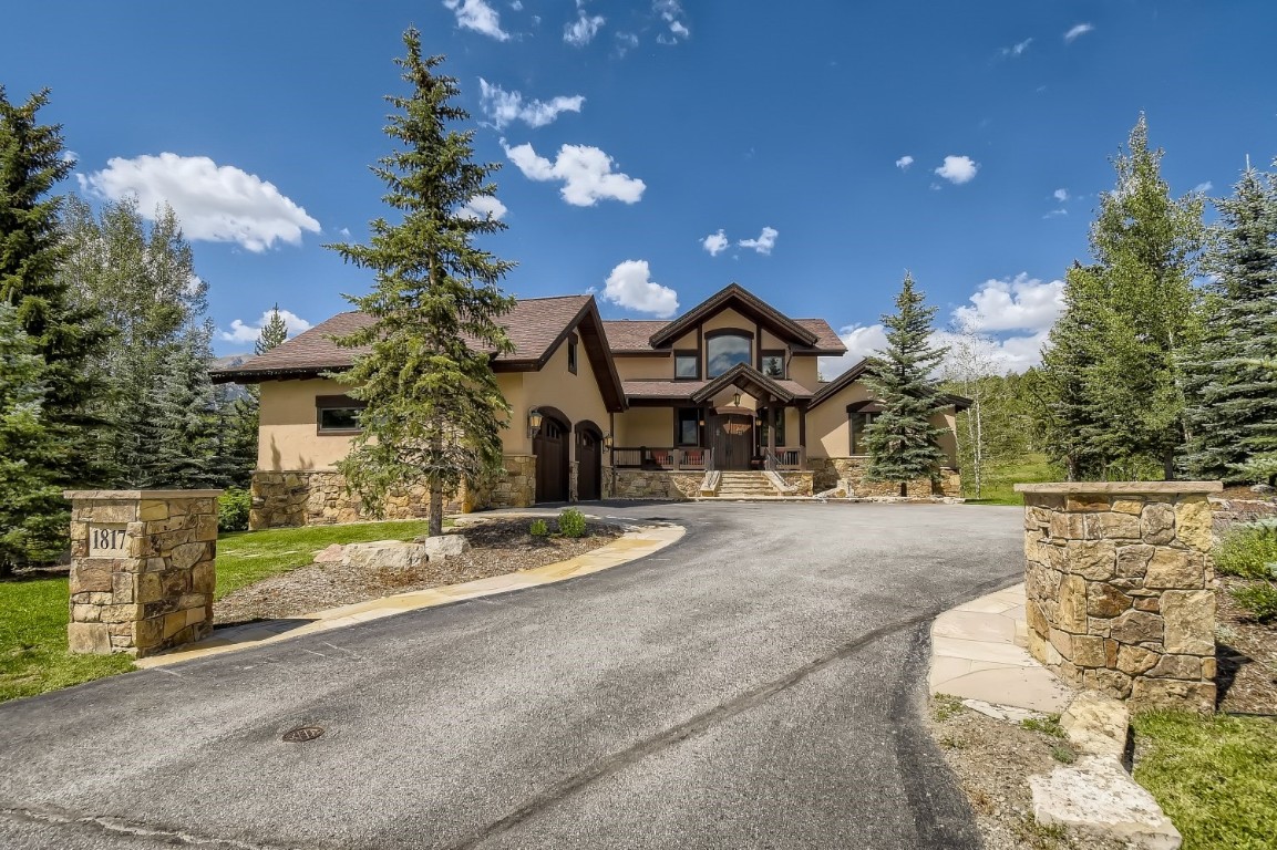 1817 Falcon Drive Silverthorne, CO 80498 - Photo 2 of 37 a front view of a house with a yard