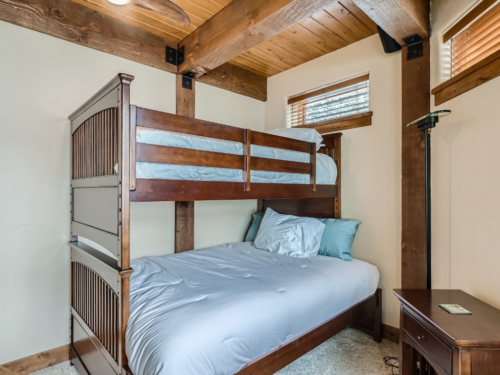 1817 Falcon Drive Silverthorne, CO 80498 - Photo 32 of 37 a bedroom with a bed and a window