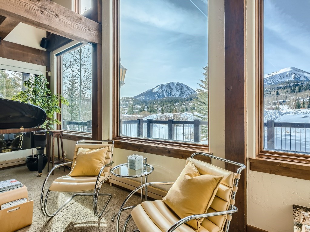1817 Falcon Drive Silverthorne, CO 80498 - Photo 6 of 37 a living room with furniture and a floor to ceiling window