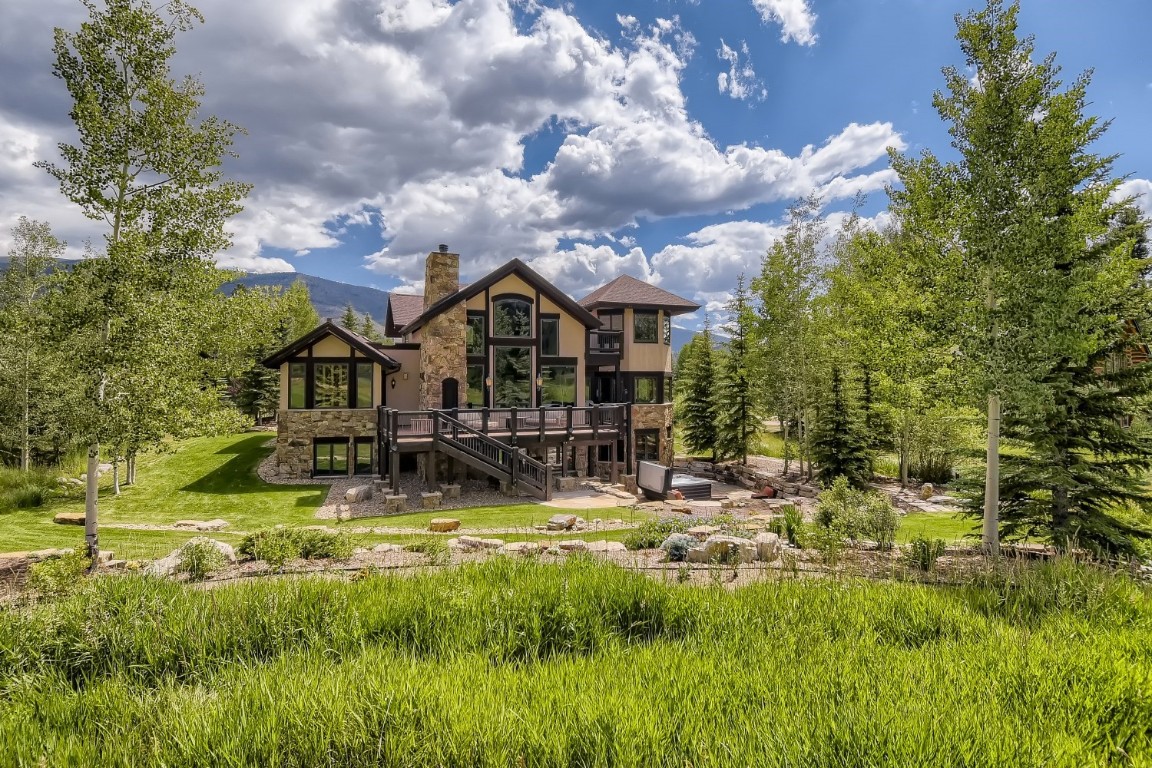 1817 Falcon Drive Silverthorne, CO 80498 - Photo 9 of 37 a view of a house with a big yard plants and large trees