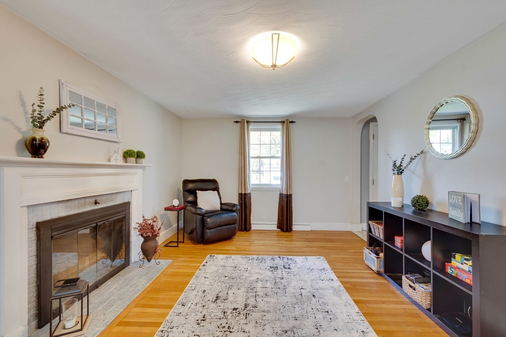 15 Williams Road North Reading, MA 01864 - Photo 12 of 38 a living room with furniture and a fireplace