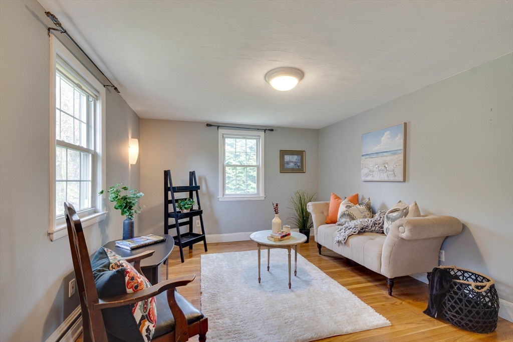 15 Williams Road North Reading, MA 01864 - Photo 17 of 38 a living room with furniture and a window