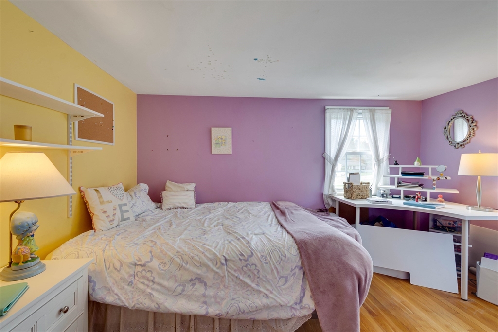 15 Williams Road North Reading, MA 01864 - Photo 27 of 38 a bedroom with a bed and a table