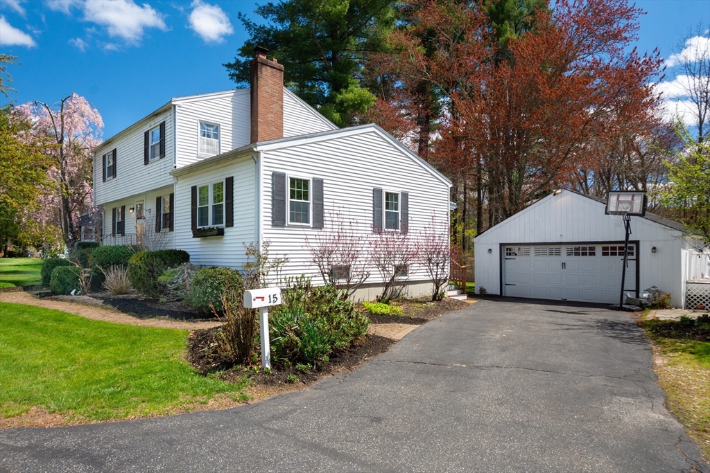 15 Williams Road North Reading, MA 01864 - Photo 34 of 38 a front view of a house with a garden and outdoor seating