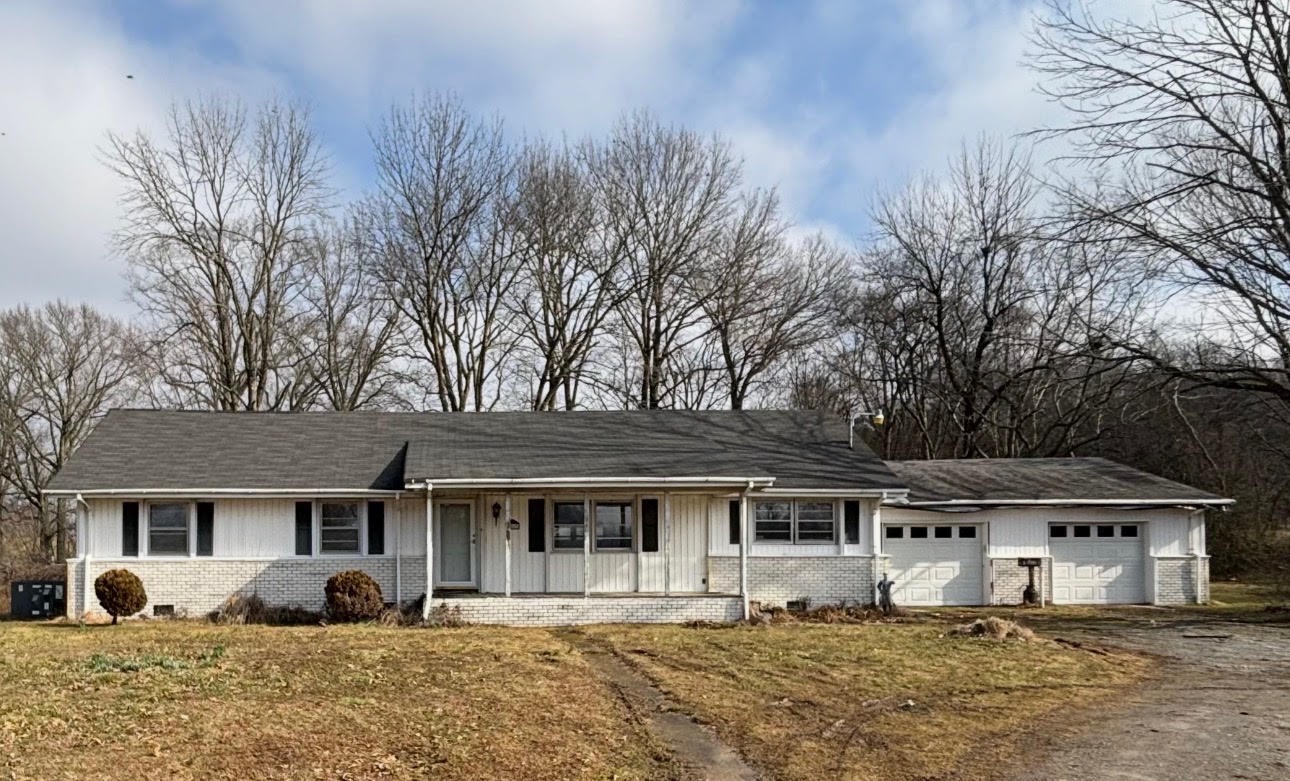 8867 Windrow Road Rockvale, TN 37153 - Photo 1 of 1 a front view of a house with a yard