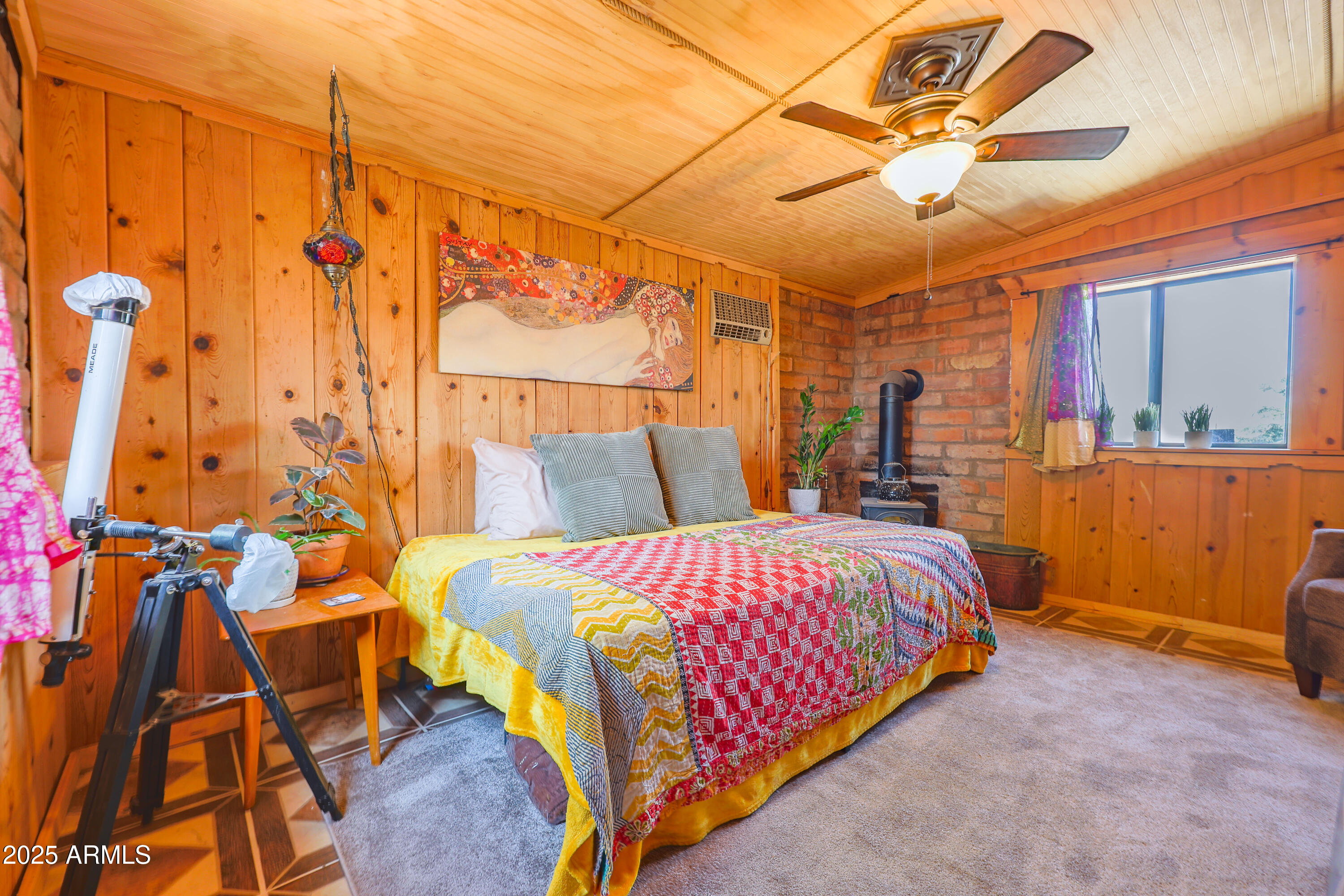 4755 West Morin Road McNeal, AZ 85617 - Photo 16 of 37 a bedroom with a bed and wooden floor