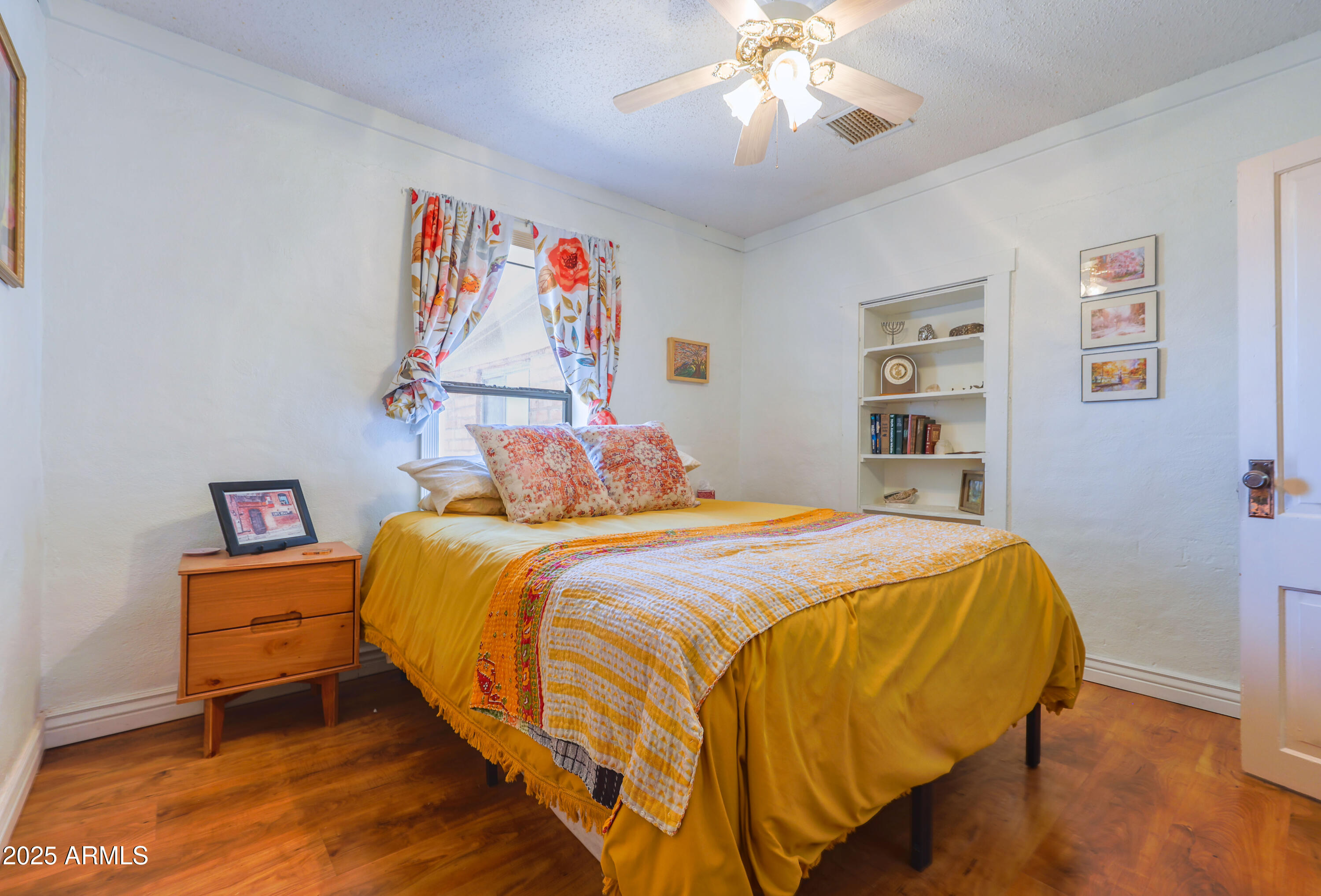 4755 West Morin Road McNeal, AZ 85617 - Photo 18 of 37 a bedroom with a bed and a chandelier