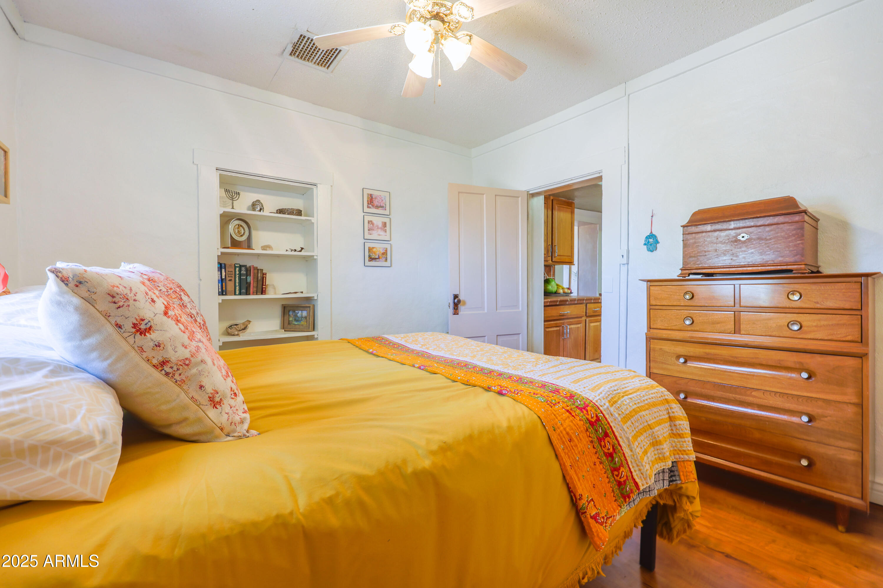 4755 West Morin Road McNeal, AZ 85617 - Photo 19 of 37 a bedroom with a bed and a chandelier
