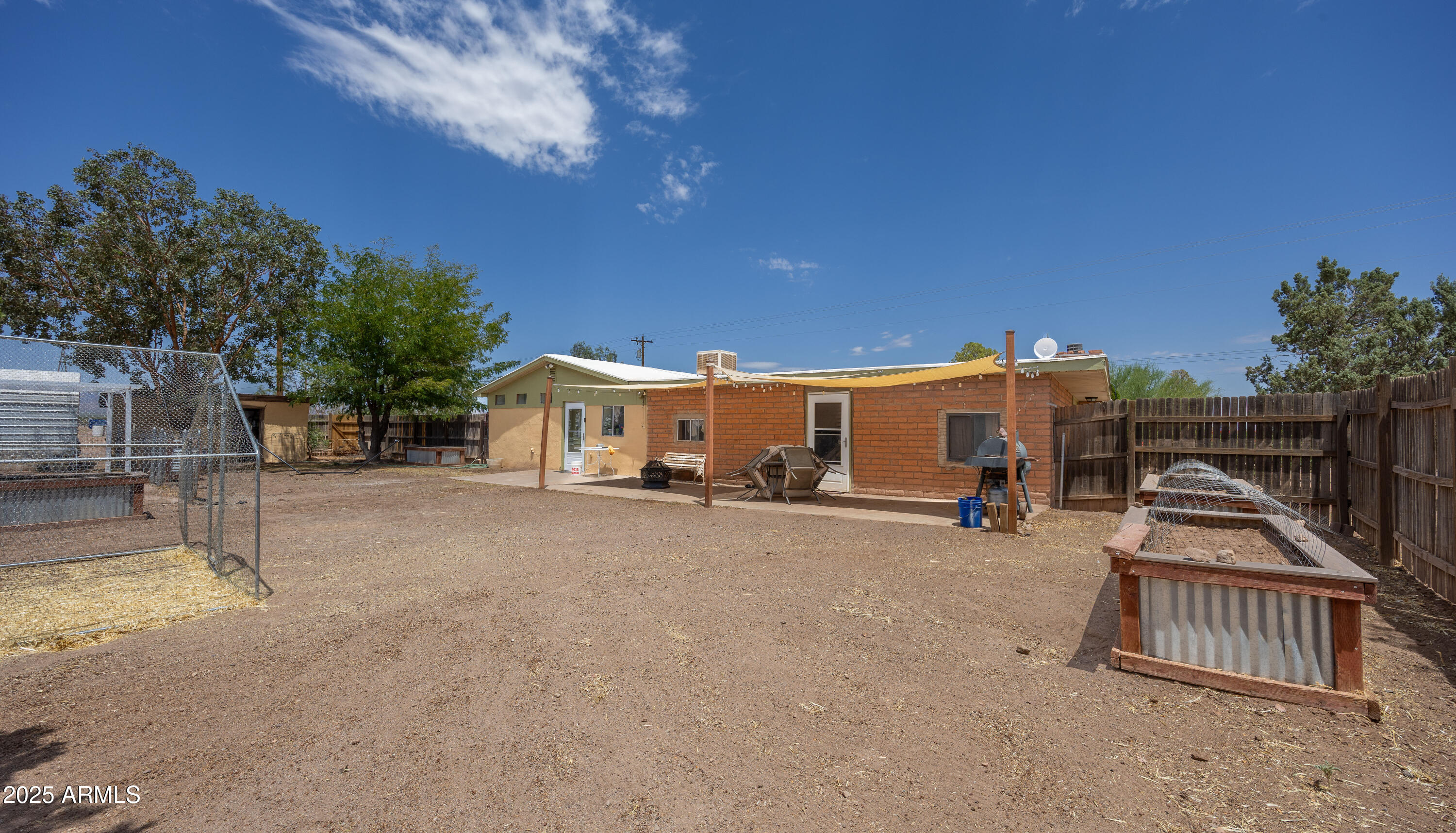 4755 West Morin Road McNeal, AZ 85617 - Photo 21 of 37 a view of a house with backyard and a tree