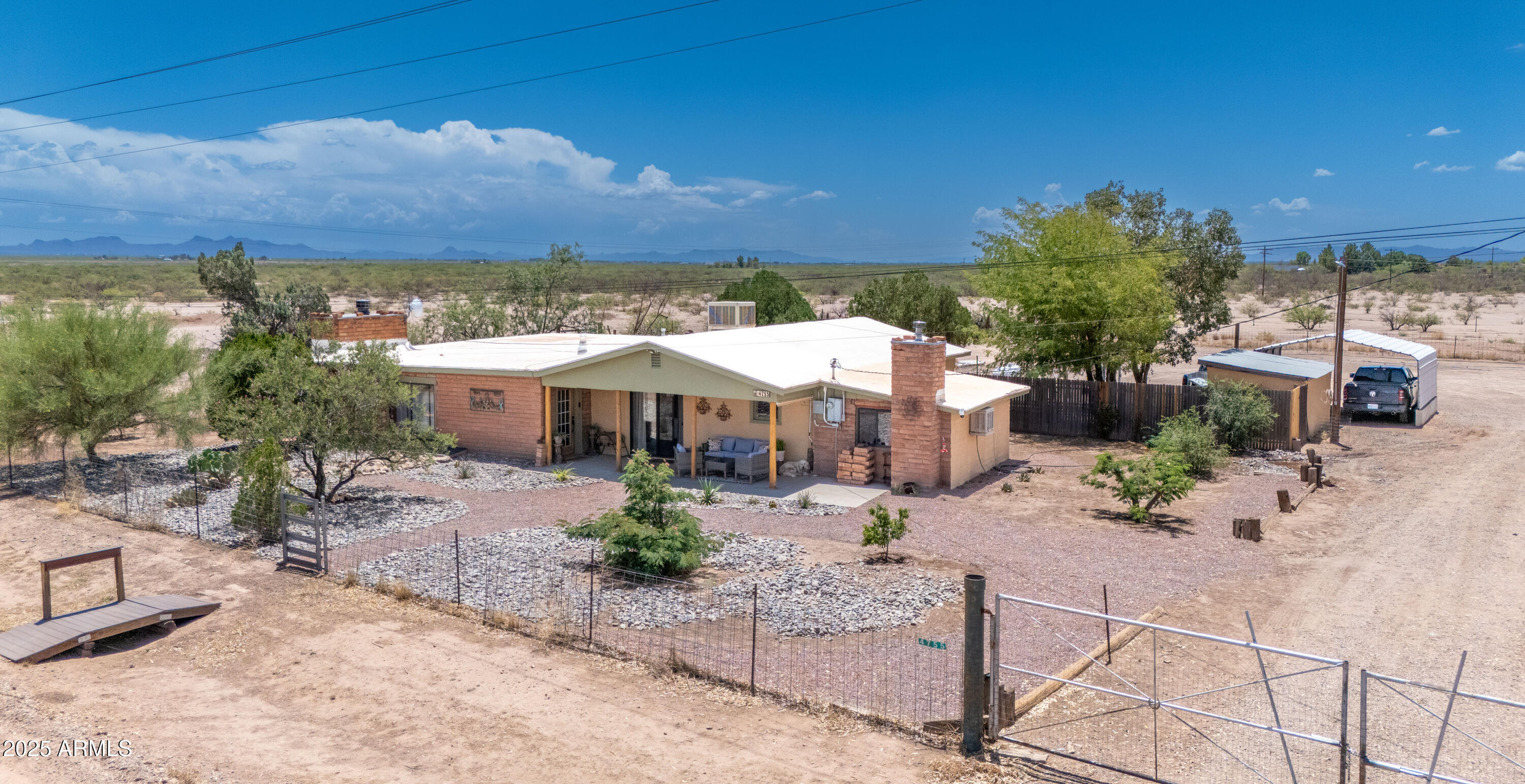 4755 West Morin Road McNeal, AZ 85617 - Photo 26 of 37 a view of a patio with a table and chairs under an umbrella