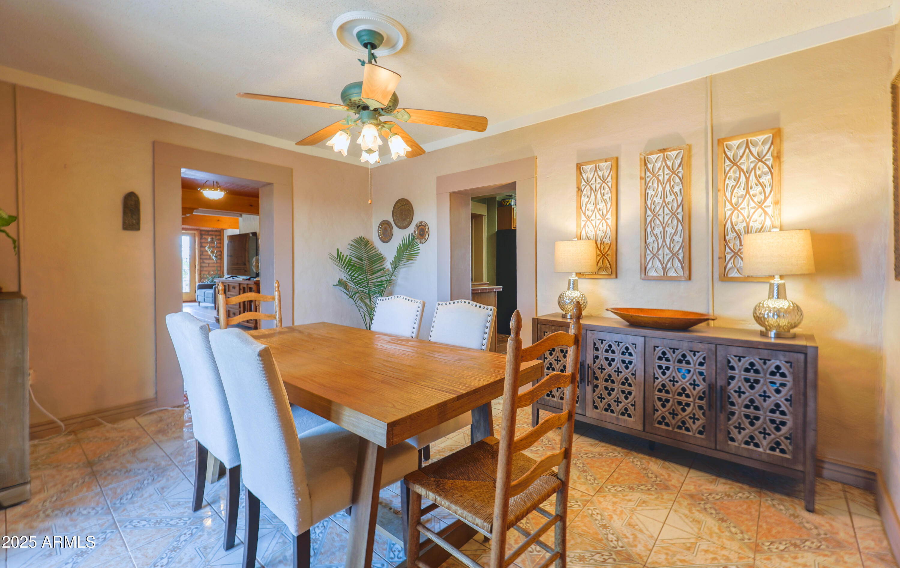 4755 West Morin Road McNeal, AZ 85617 - Photo 10 of 37 a view of a dining room with furniture and a chandelier