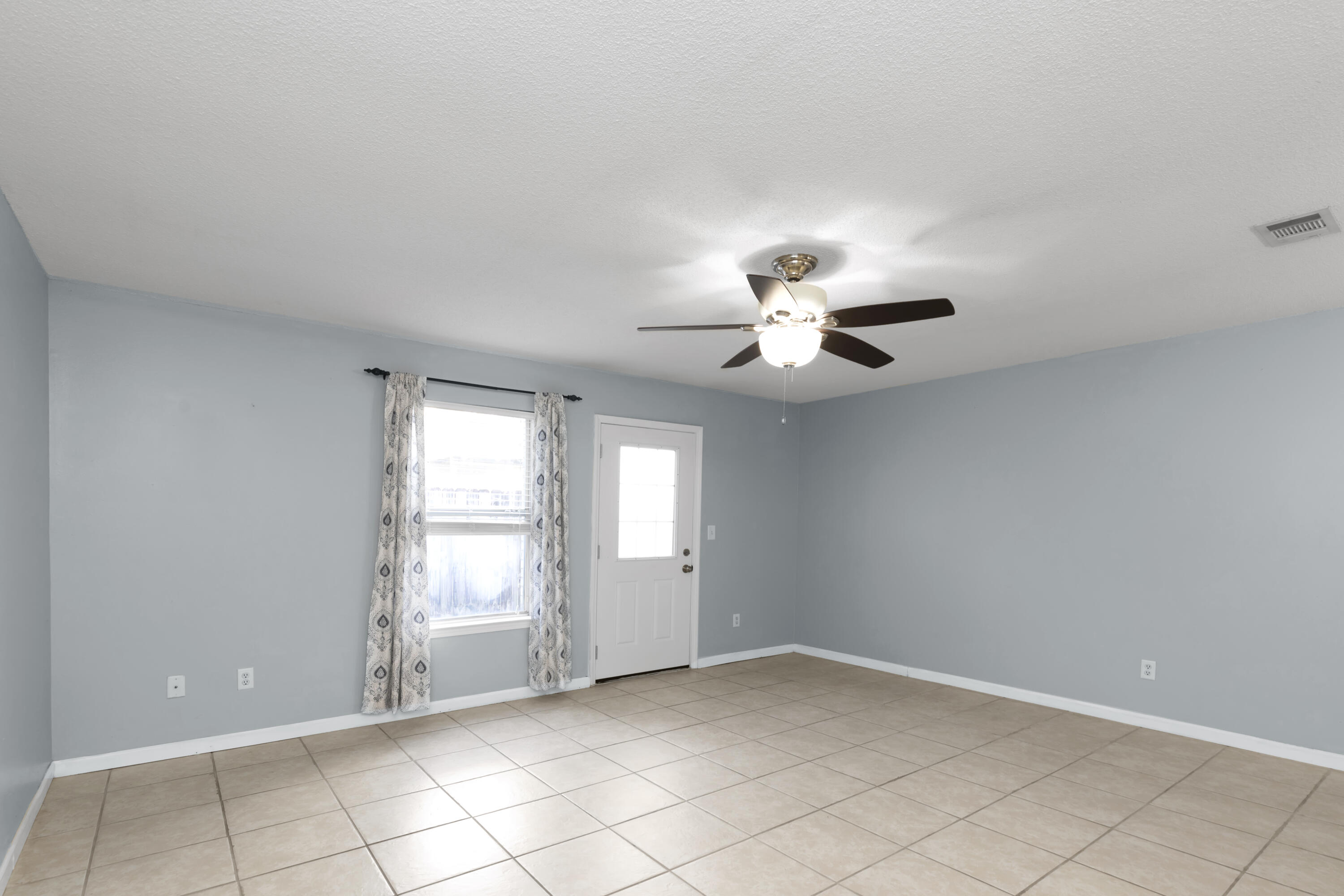 501 Keystone Road Mary Esther, FL 32569 - Photo 11 of 36 a view of an empty room with a window