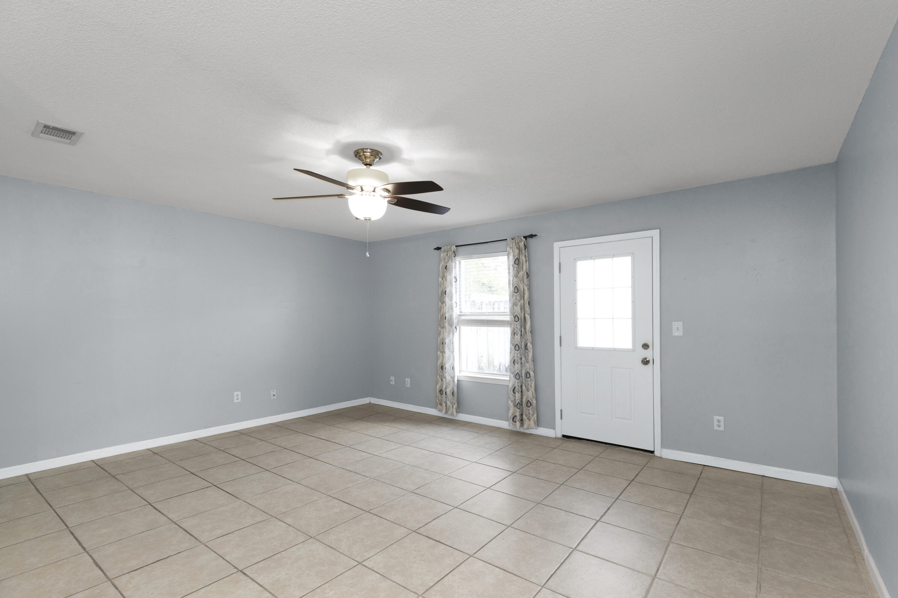 501 Keystone Road Mary Esther, FL 32569 - Photo 12 of 36 a view of an empty room with a window