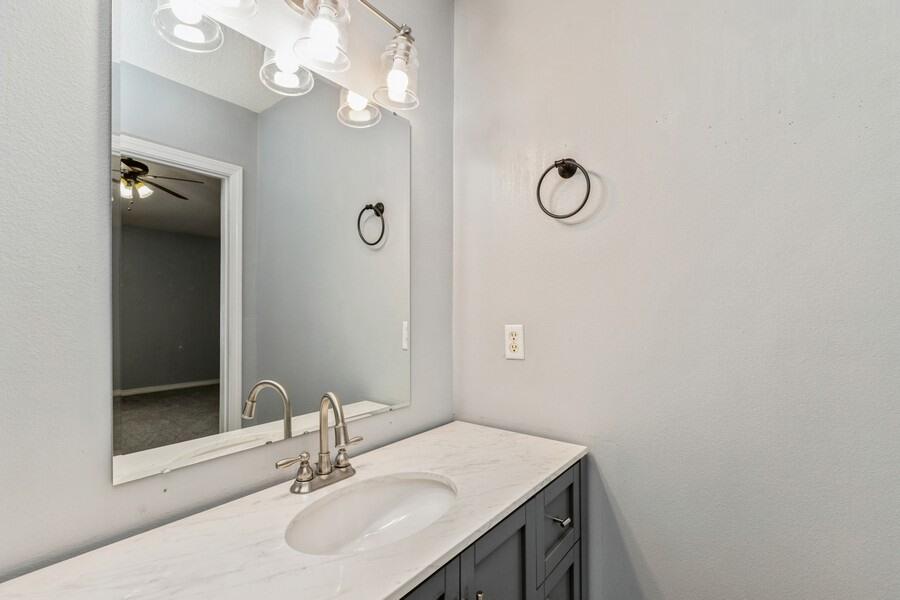 501 Keystone Road Mary Esther, FL 32569 - Photo 26 of 36 a bathroom with a sink vanity and a mirror