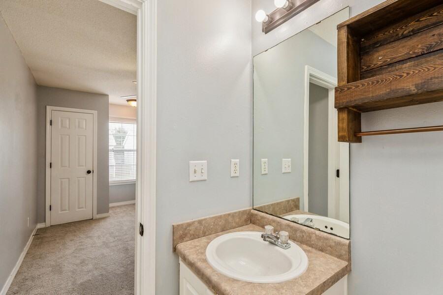 501 Keystone Road Mary Esther, FL 32569 - Photo 33 of 36 a bathroom with a sink and a mirror