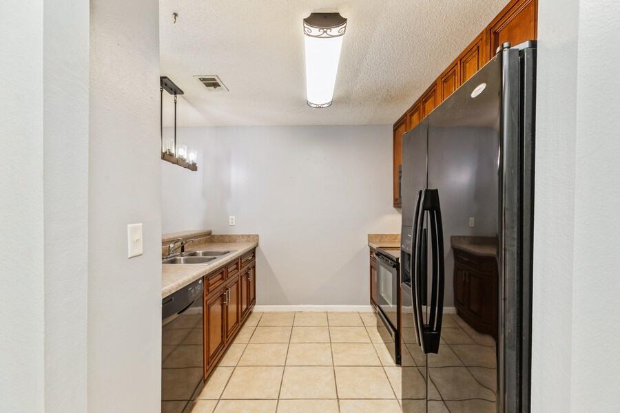 501 Keystone Road Mary Esther, FL 32569 - Photo 6 of 36 a kitchen with a stove top oven and refrigerator