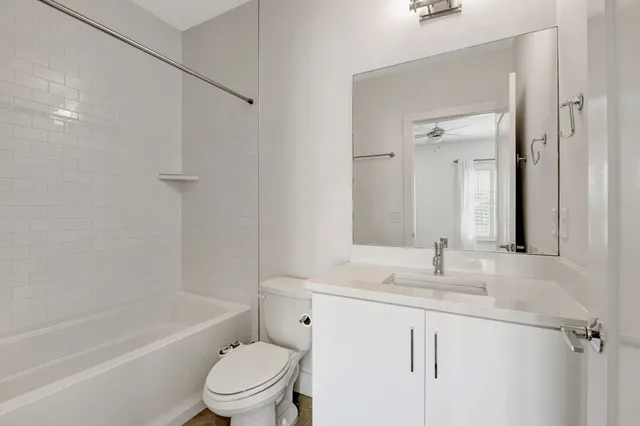 a bathroom with a sink toilet tub and shower