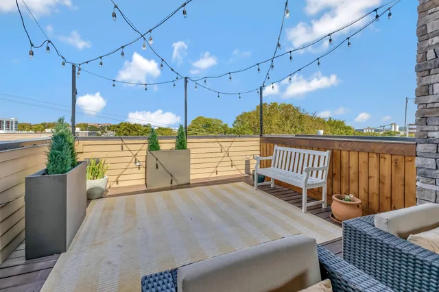 a view of a balcony with chairs