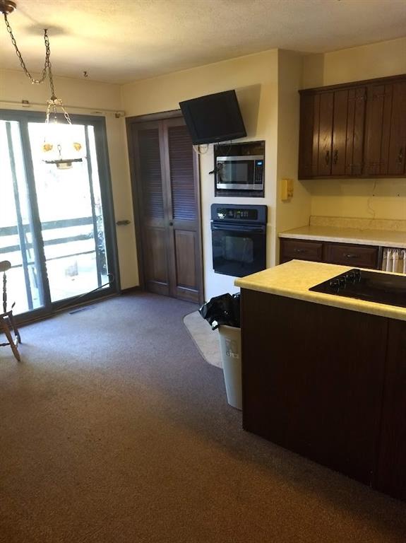 278 Holyoke Road Butler, PA 16001 - Photo 12 of 24 a kitchen with stainless steel appliances kitchen island sink refrigerator and stove