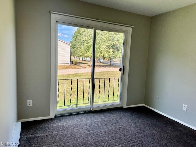 4376 Darrow Road, Unit 7 Stow, OH 44224 - Photo 12 of 23 Unfurnished room with a baseboard radiator and dark colored carpet