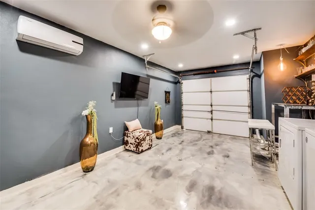 a bedroom with furniture and a flat screen tv