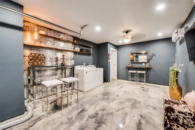 a living room with a couch and a table with wooden floor