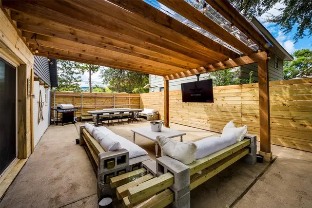 a outdoor space with patio furniture and a fireplace