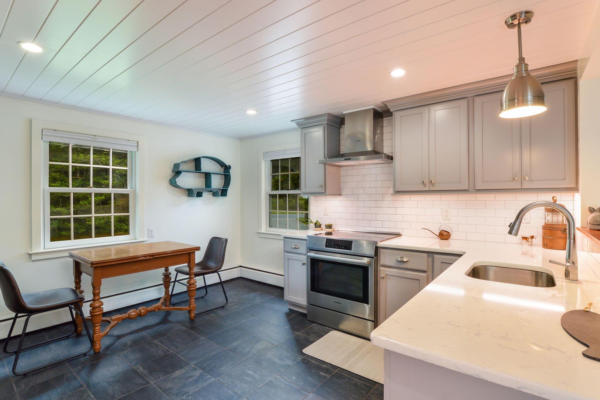 141 Pond View Drive Centerville, MA 02632 - Photo 14 of 44 a kitchen that has a sink and a stove top oven