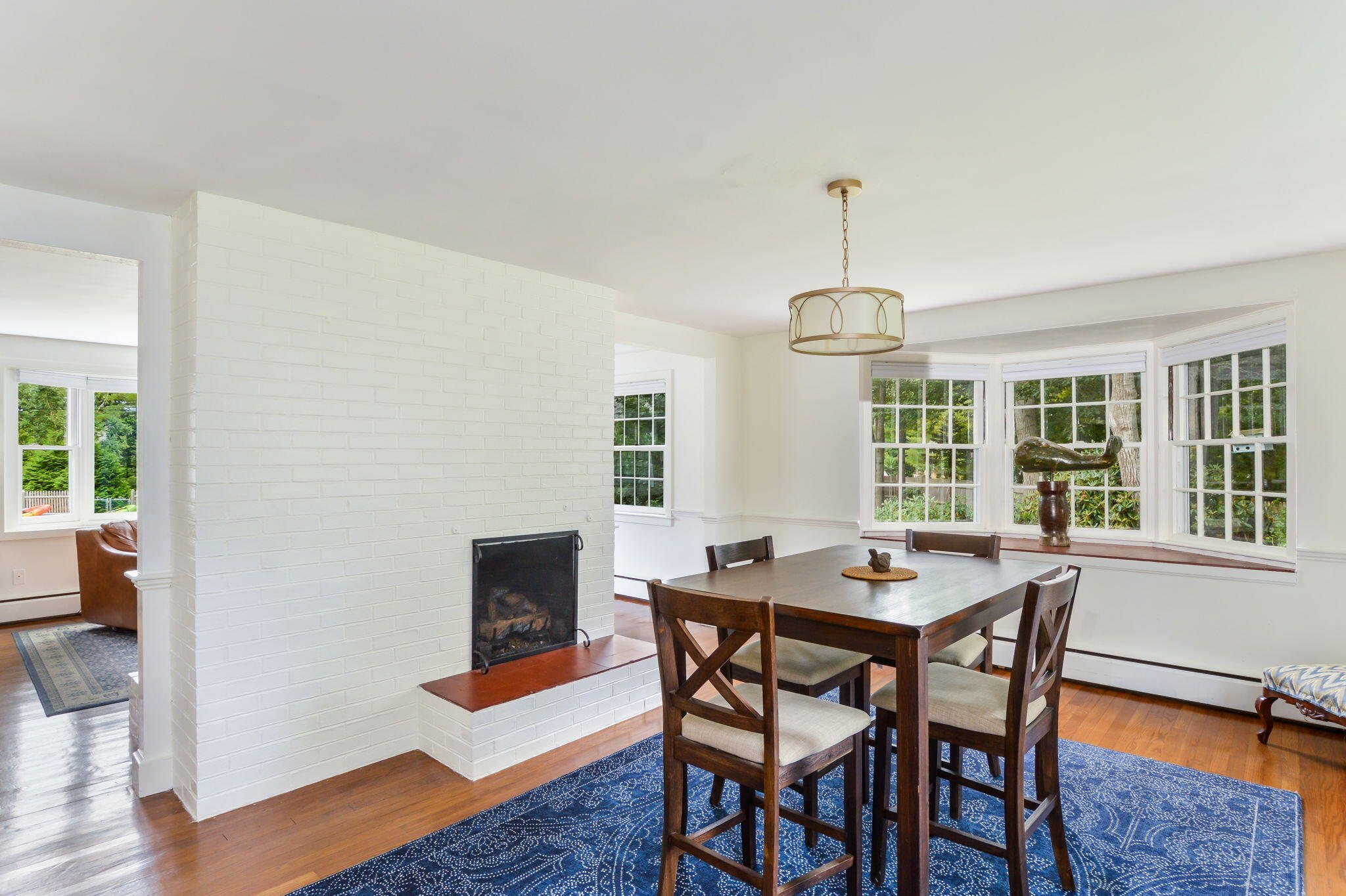 141 Pond View Drive Centerville, MA 02632 - Photo 17 of 44 a dining room with a wooden table and chairs