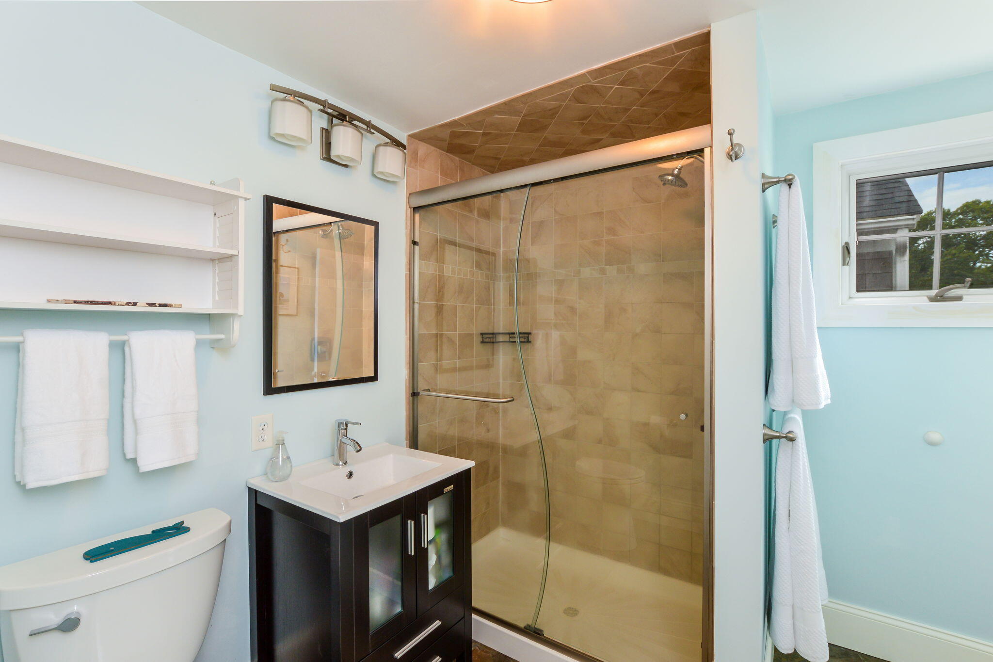 141 Pond View Drive Centerville, MA 02632 - Photo 26 of 44 a bathroom with a shower sink vanity and mirror