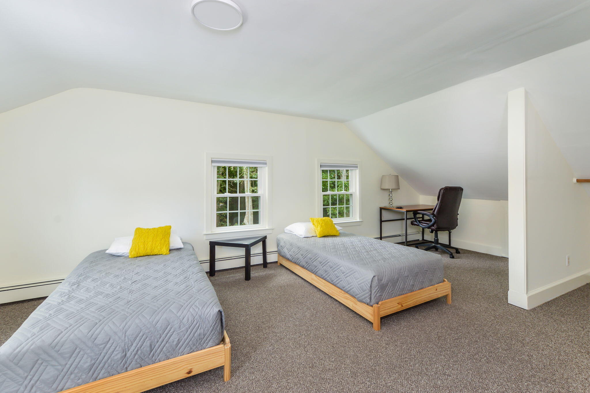 141 Pond View Drive Centerville, MA 02632 - Photo 28 of 44 a bedroom with a bed and table chair