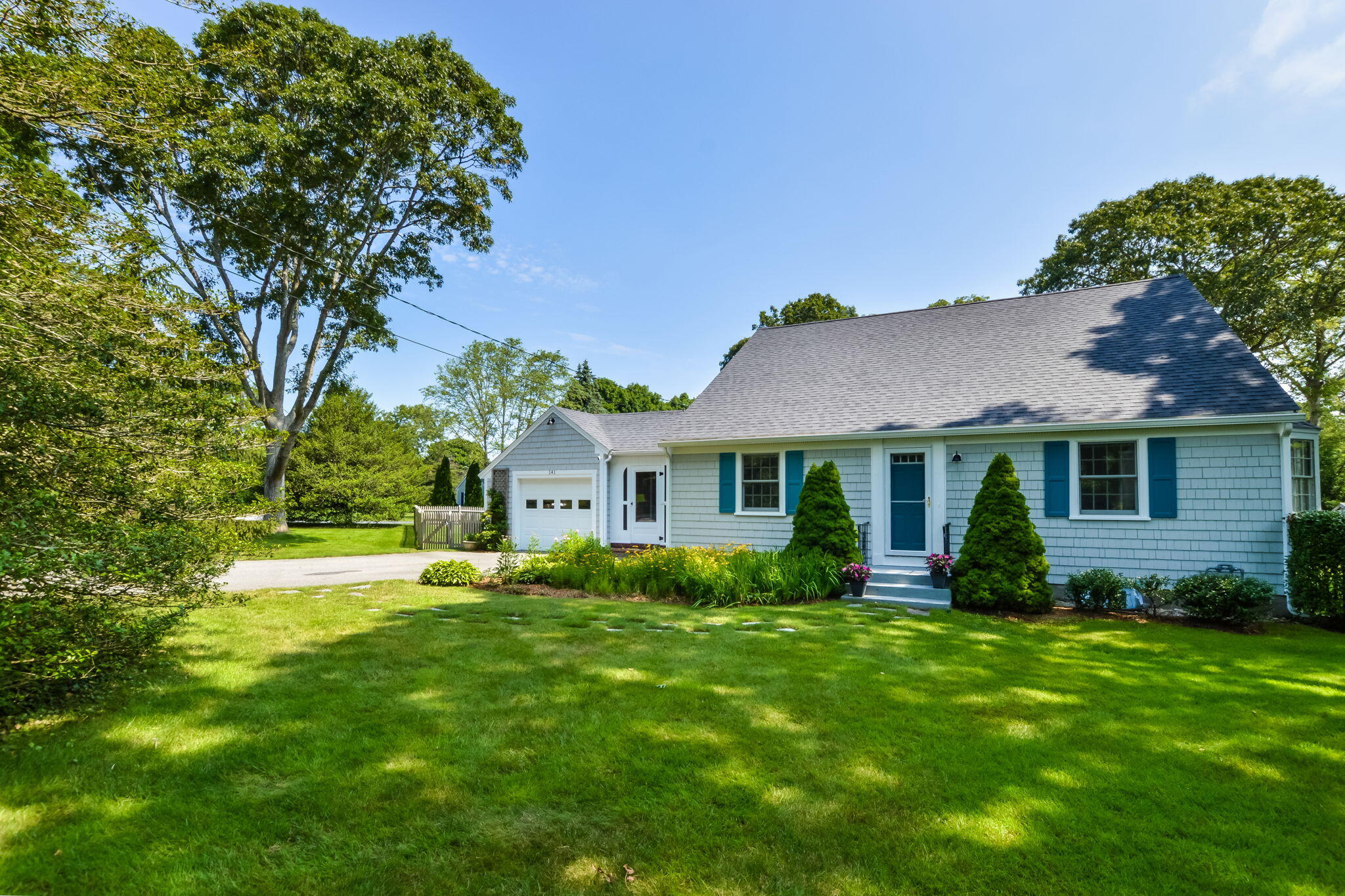 141 Pond View Drive Centerville, MA 02632 - Photo 3 of 44 a front view of house with yard and green space