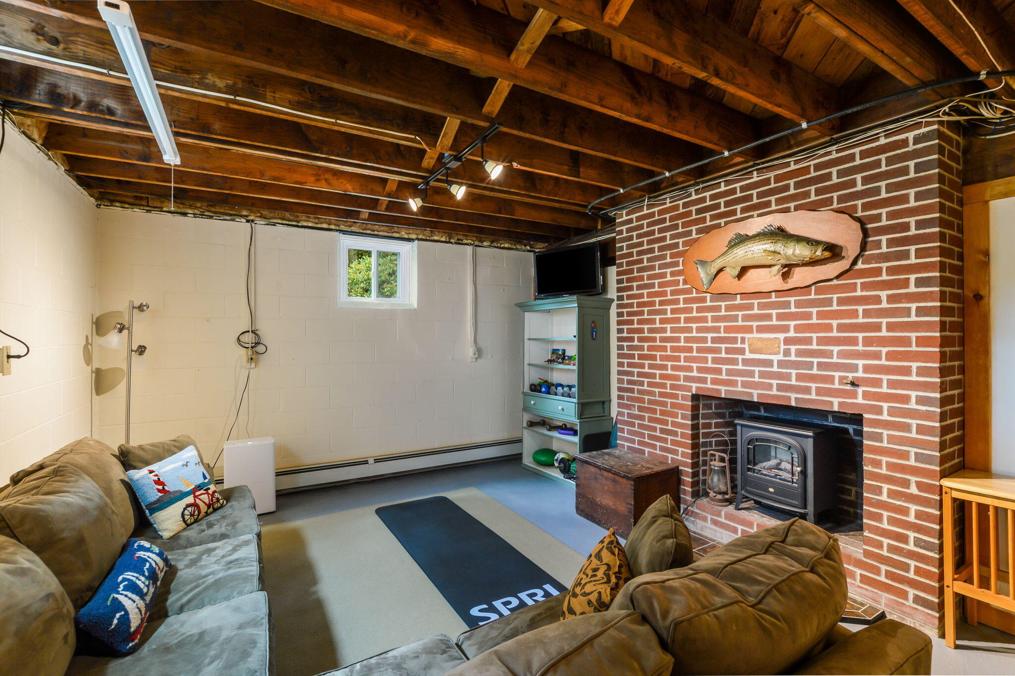 141 Pond View Drive Centerville, MA 02632 - Photo 32 of 44 a living room with furniture and a fireplace