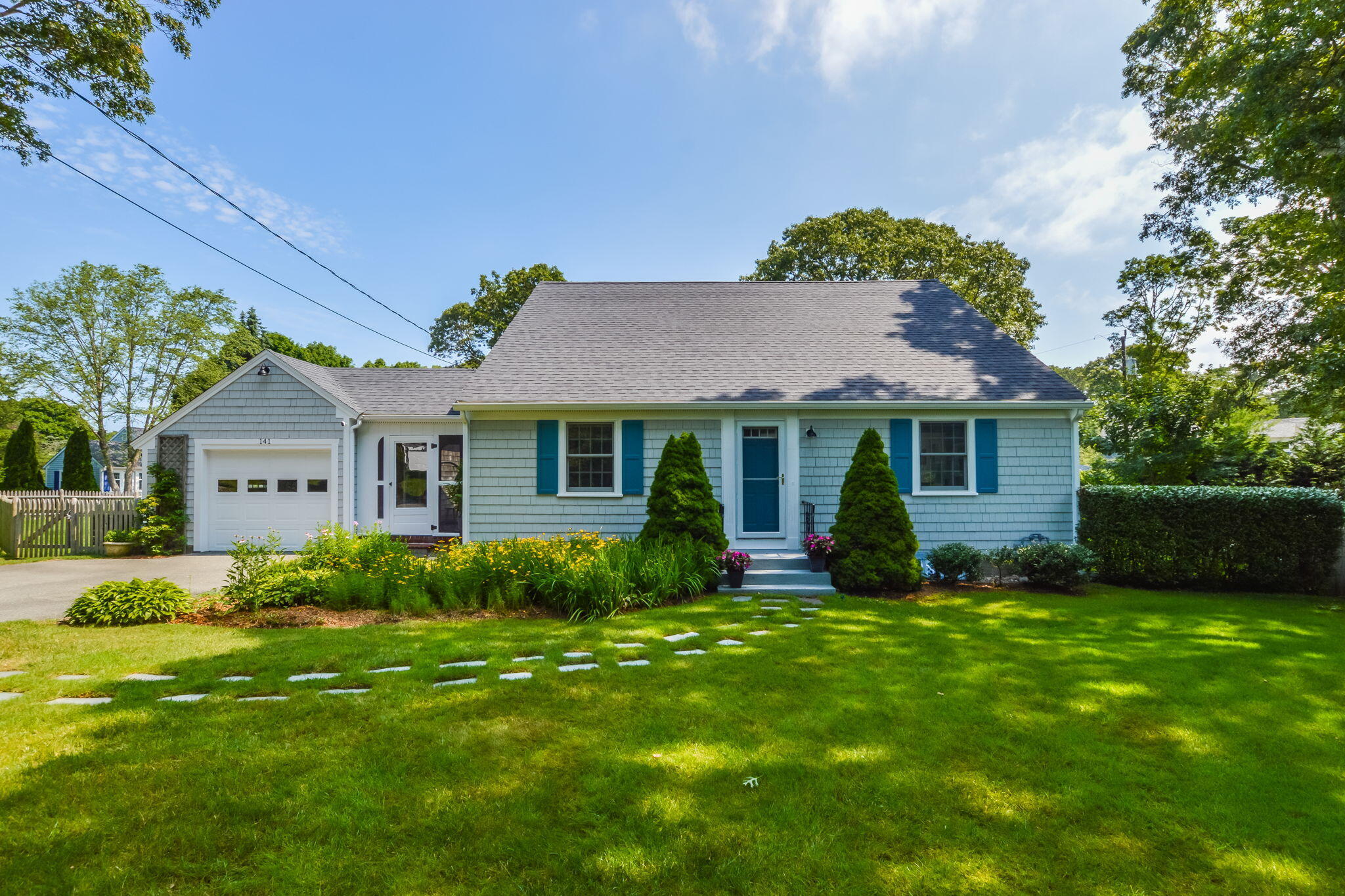141 Pond View Drive Centerville, MA 02632 - Photo 34 of 44 a view of a house with a yard and potted plants