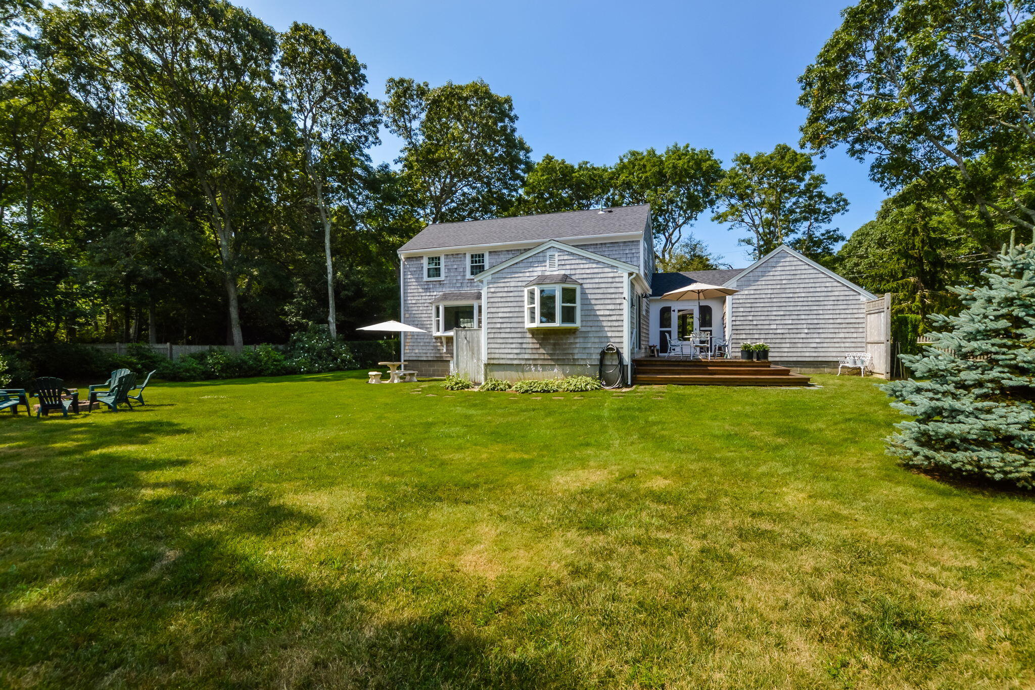 141 Pond View Drive Centerville, MA 02632 - Photo 8 of 44 a front view of house with yard and green space