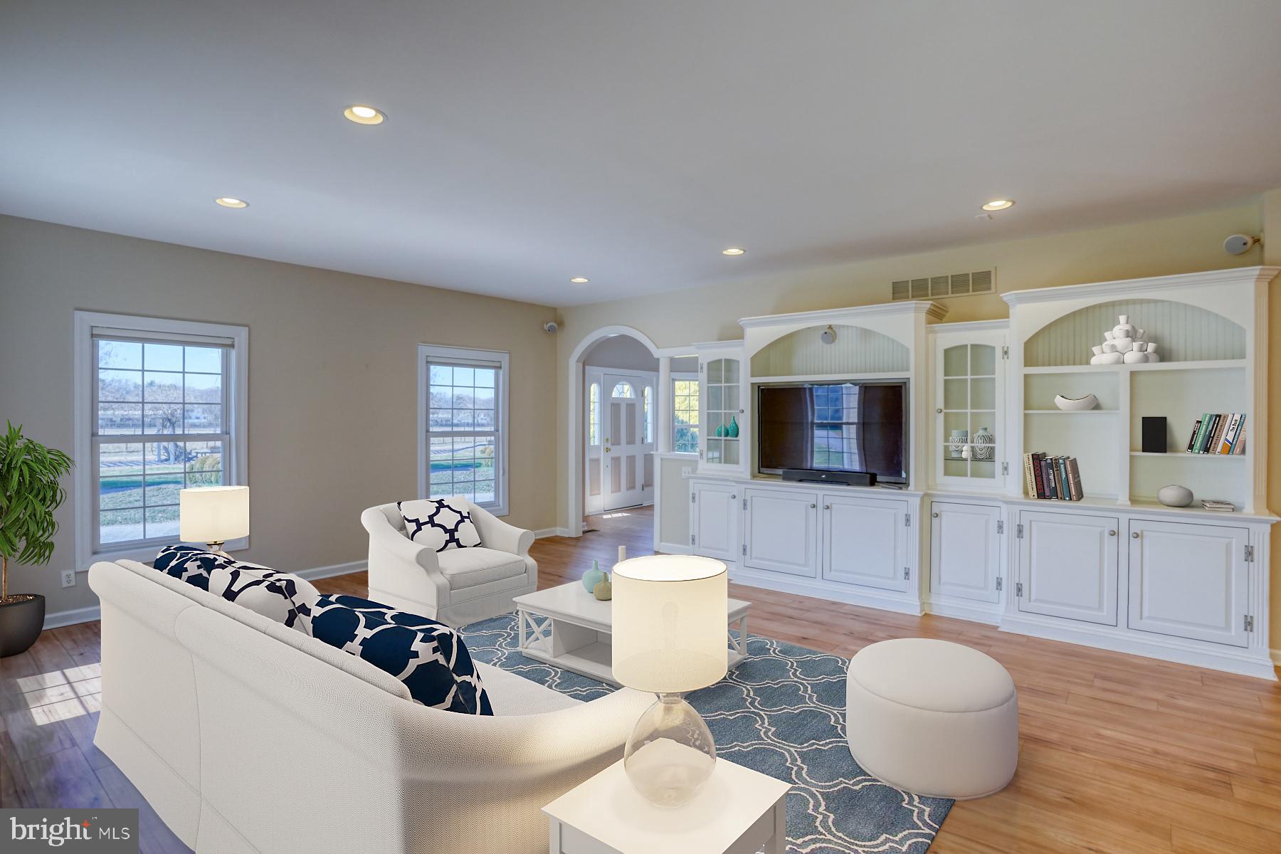 18605 Road 255 Georgetown, DE 19947 - Photo 20 of 93 a living room with furniture and a flat screen tv