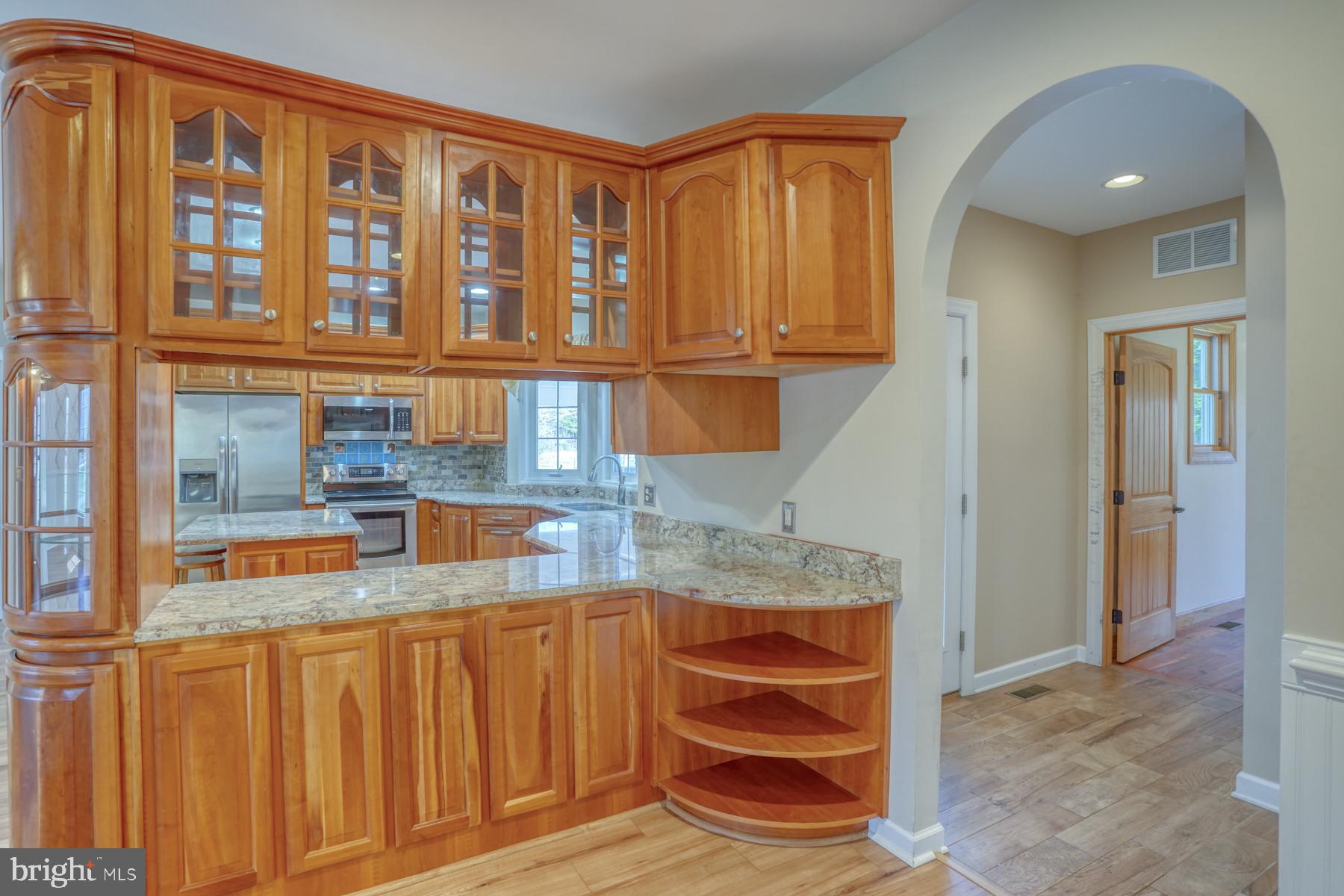 18605 Road 255 Georgetown, DE 19947 - Photo 25 of 93 a view of kitchen with granite countertop cabinets and entryway