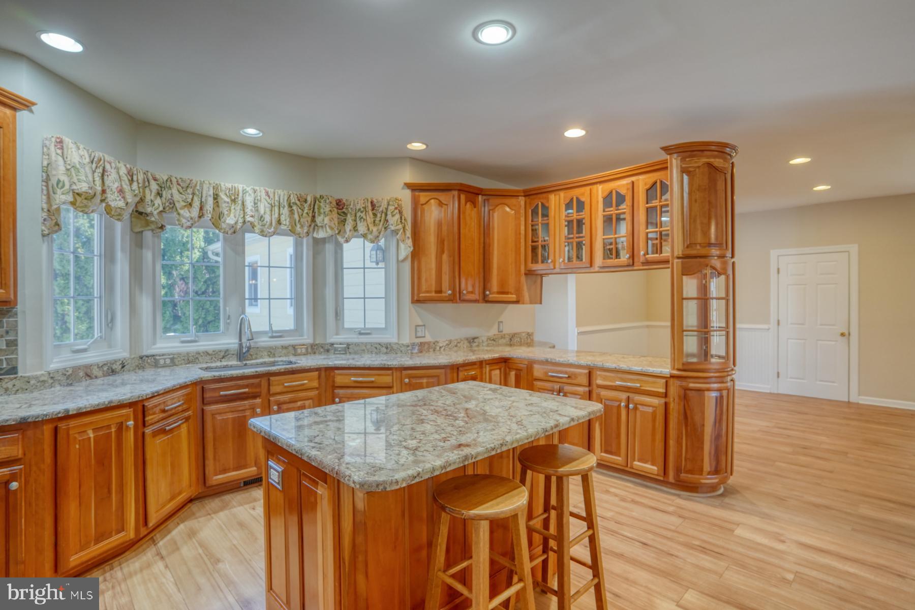 18605 Road 255 Georgetown, DE 19947 - Photo 28 of 93 a kitchen with stainless steel appliances granite countertop a sink and a refrigerator