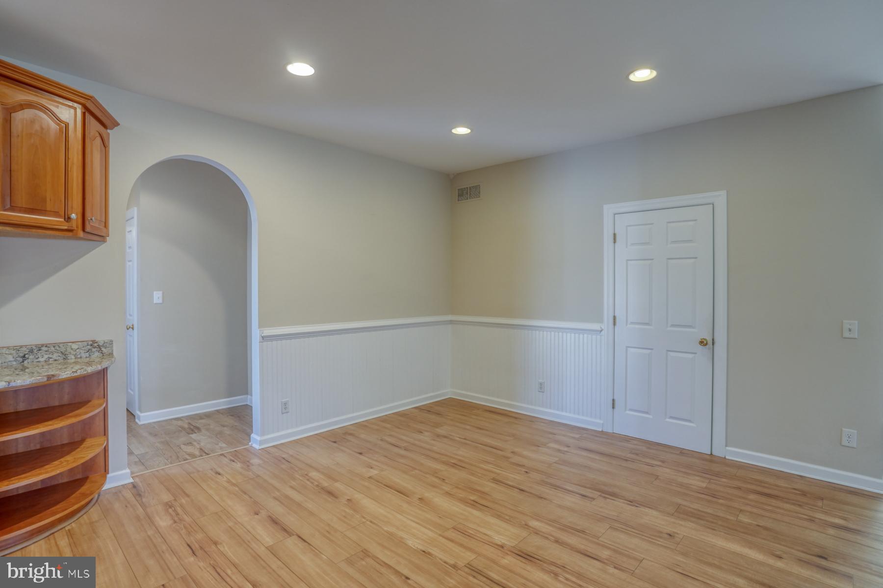 18605 Road 255 Georgetown, DE 19947 - Photo 32 of 93 wooden floor in an empty room with a window