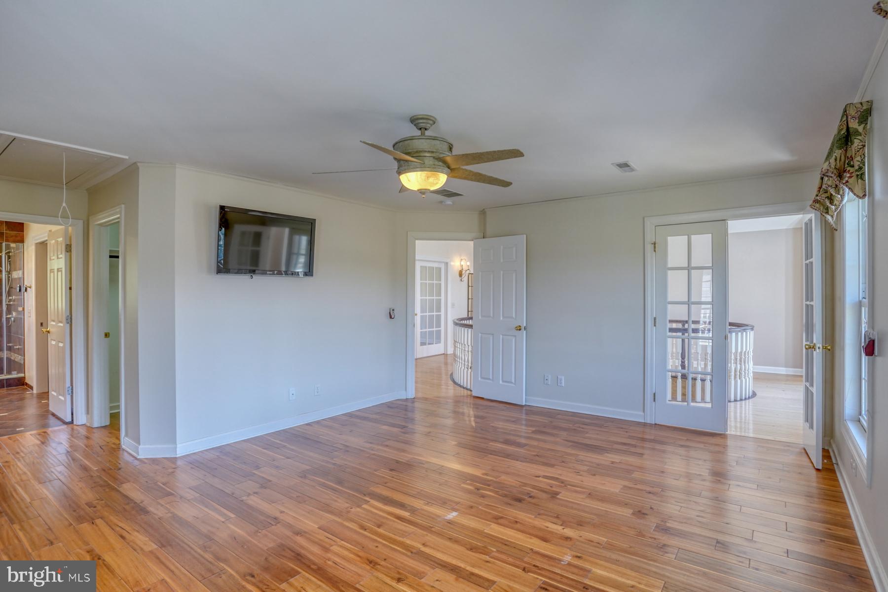 18605 Road 255 Georgetown, DE 19947 - Photo 55 of 93 a view of an empty room with a window and wooden floor