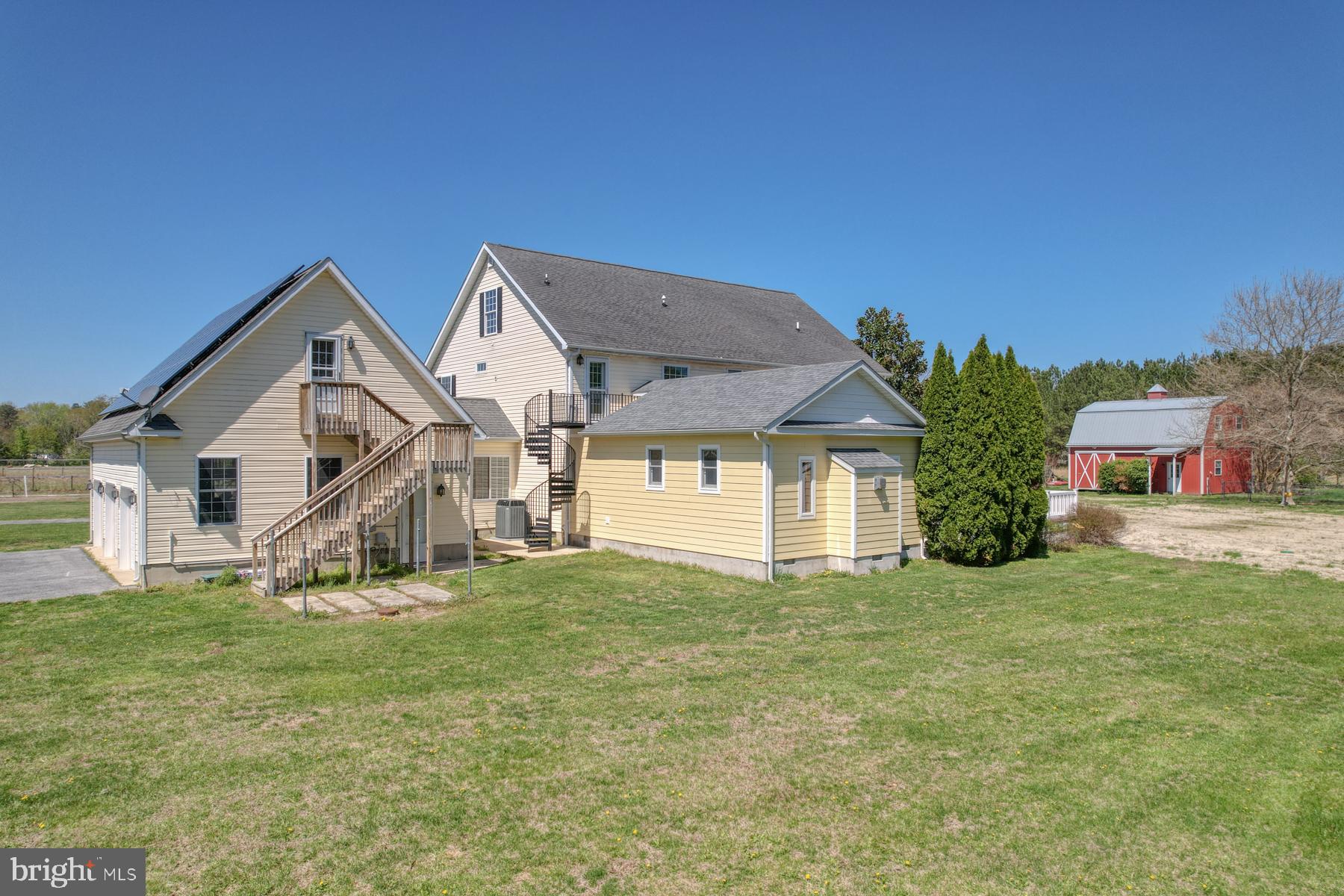 18605 Road 255 Georgetown, DE 19947 - Photo 68 of 93 a view of a house with a big yard and large trees