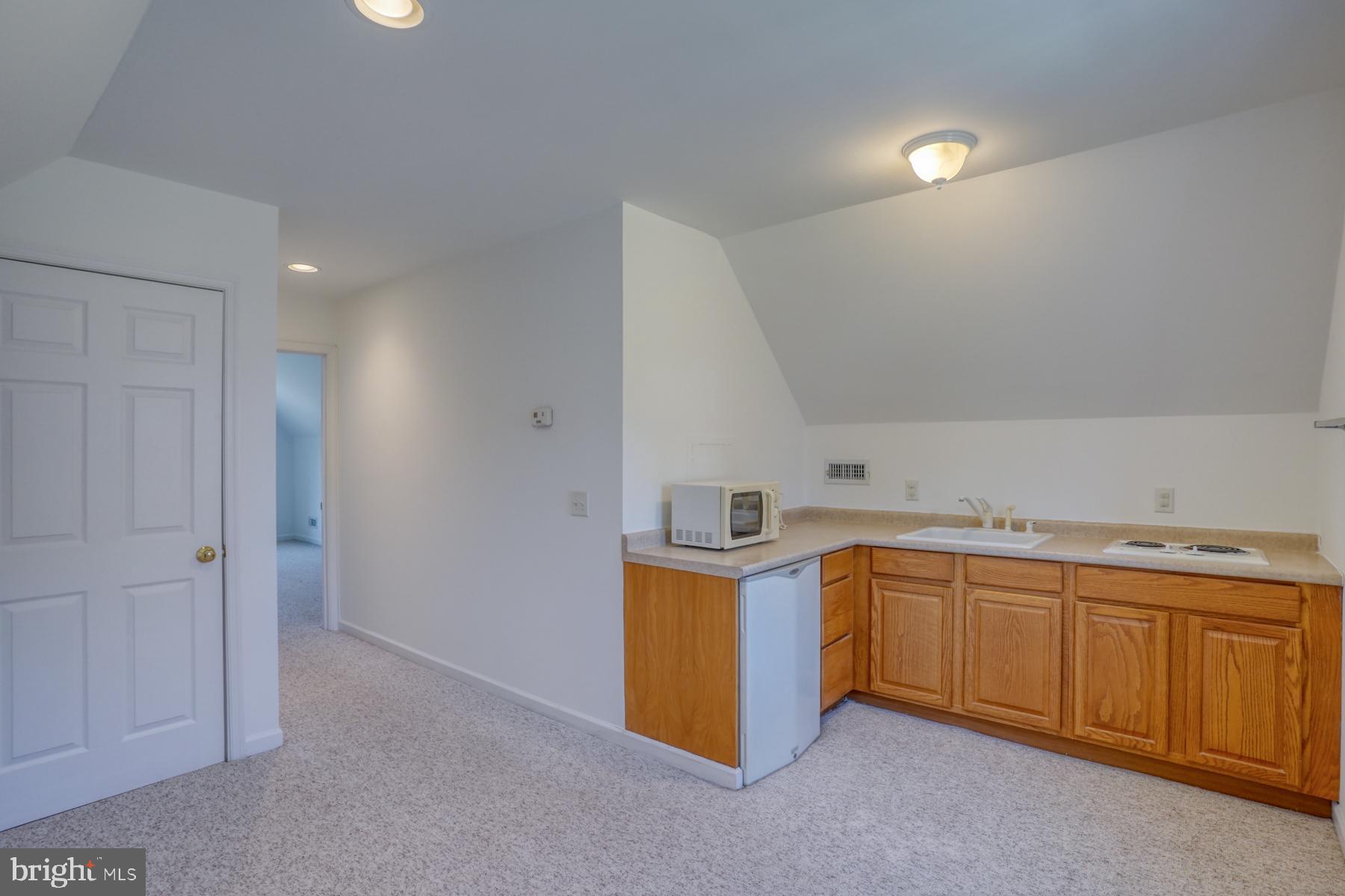 18605 Road 255 Georgetown, DE 19947 - Photo 70 of 93 a kitchen with stainless steel appliances a sink a stove a refrigerator a window