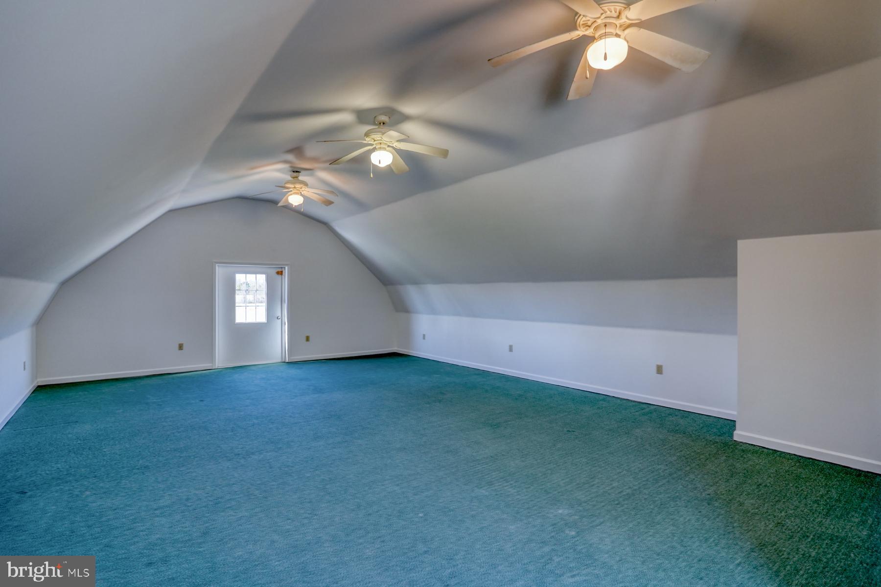 18605 Road 255 Georgetown, DE 19947 - Photo 76 of 93 an empty room with a fan and a chandelier fan