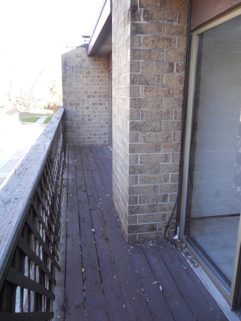 508 Kenneth Circle Elgin, IL 60120 - Photo 17 of 19 a view of wooden floor with building in front of it