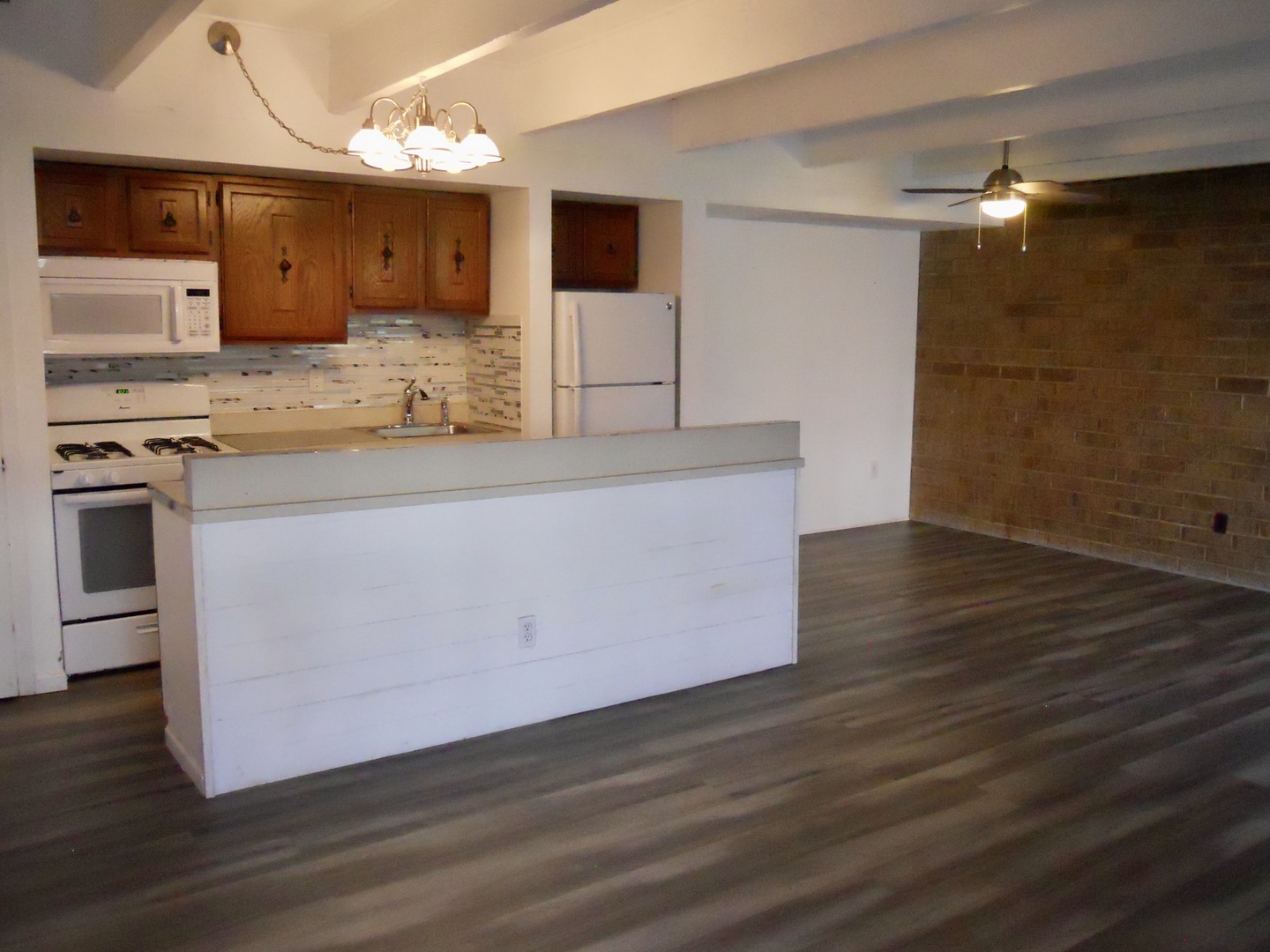 508 Kenneth Circle Elgin, IL 60120 - Photo 5 of 19 a kitchen with stainless steel appliances granite countertop a sink a stove and a wooden floors