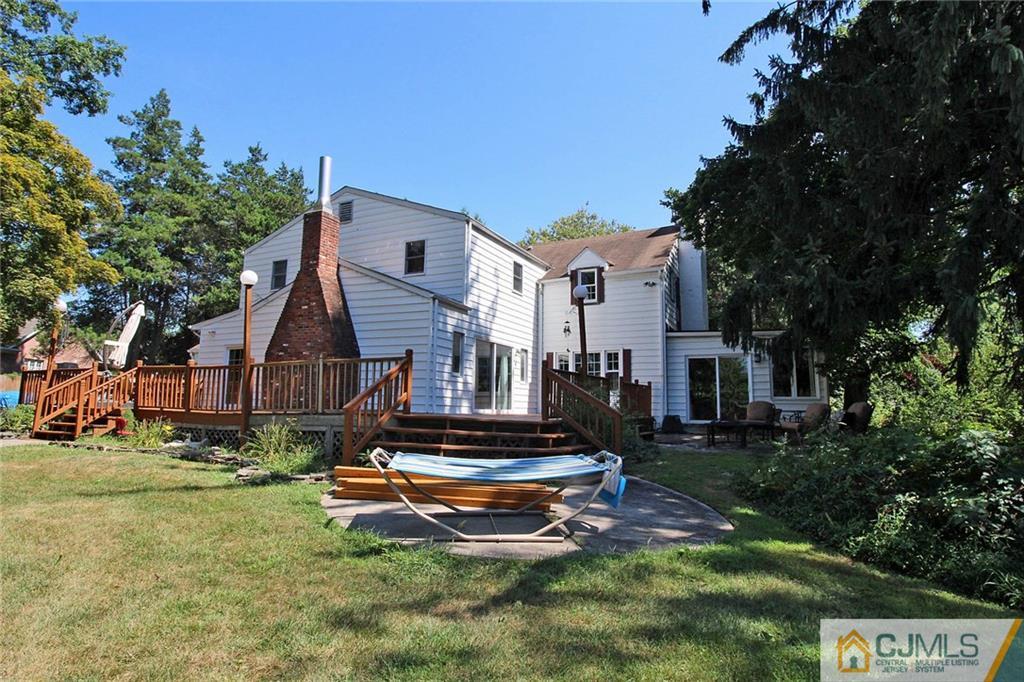 40 Stafford Road Colonia, NJ 07067 - Photo 1 of 25 a view of a house with backyard and a tree