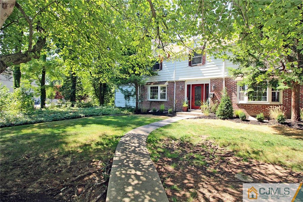 40 Stafford Road Colonia, NJ 07067 - Photo 2 of 25 a front view of house with yard and green space