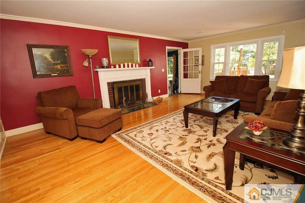 40 Stafford Road Colonia, NJ 07067 - Photo 12 of 25 a living room with furniture and a fireplace